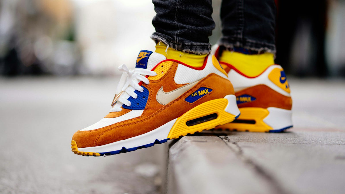 Nike TN outfits — close-up of Air Max sneakers worn on a city street