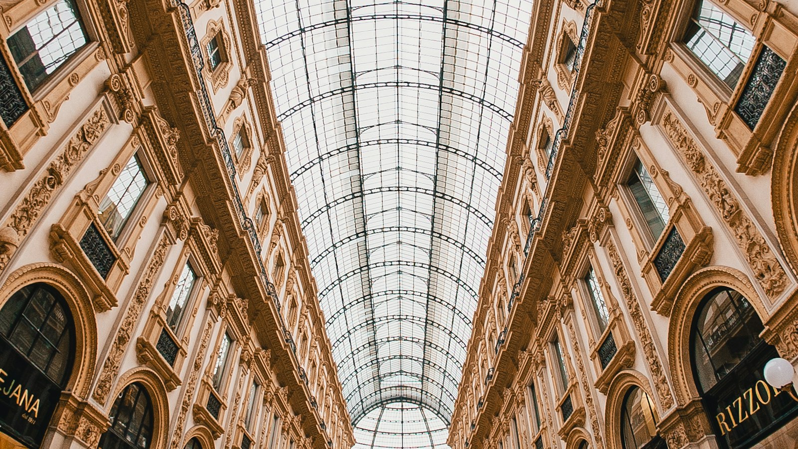 Crowds beneath the glass dome of Milan's Galleria Vittorio Emanuele II, site of Vogue World Milano 2026