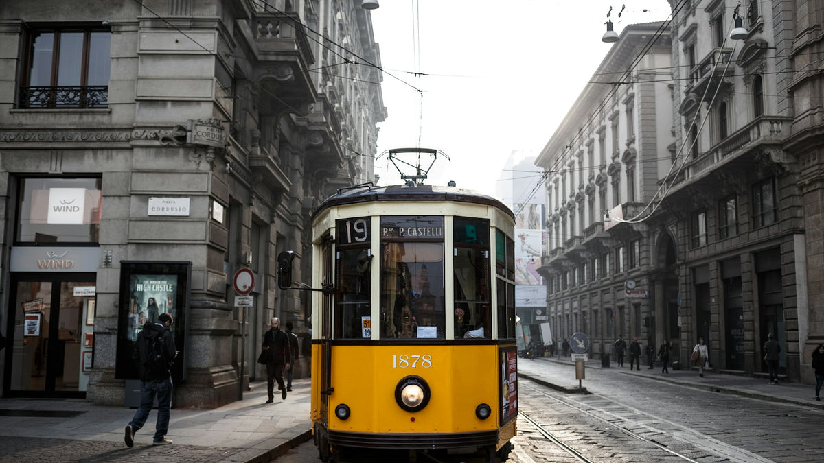 Milan Fashion Week 2026: a classic yellow tram crossing the streets of Milan, Italy