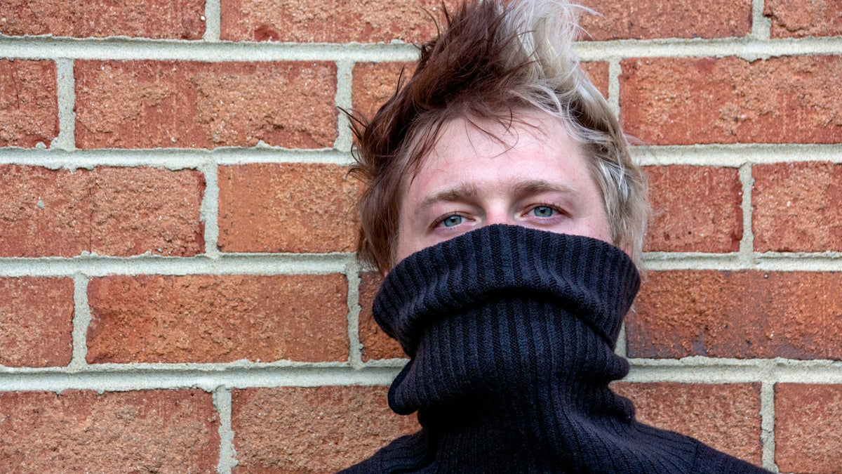 How to style a turtleneck — black turtleneck styled with moody editorial energy