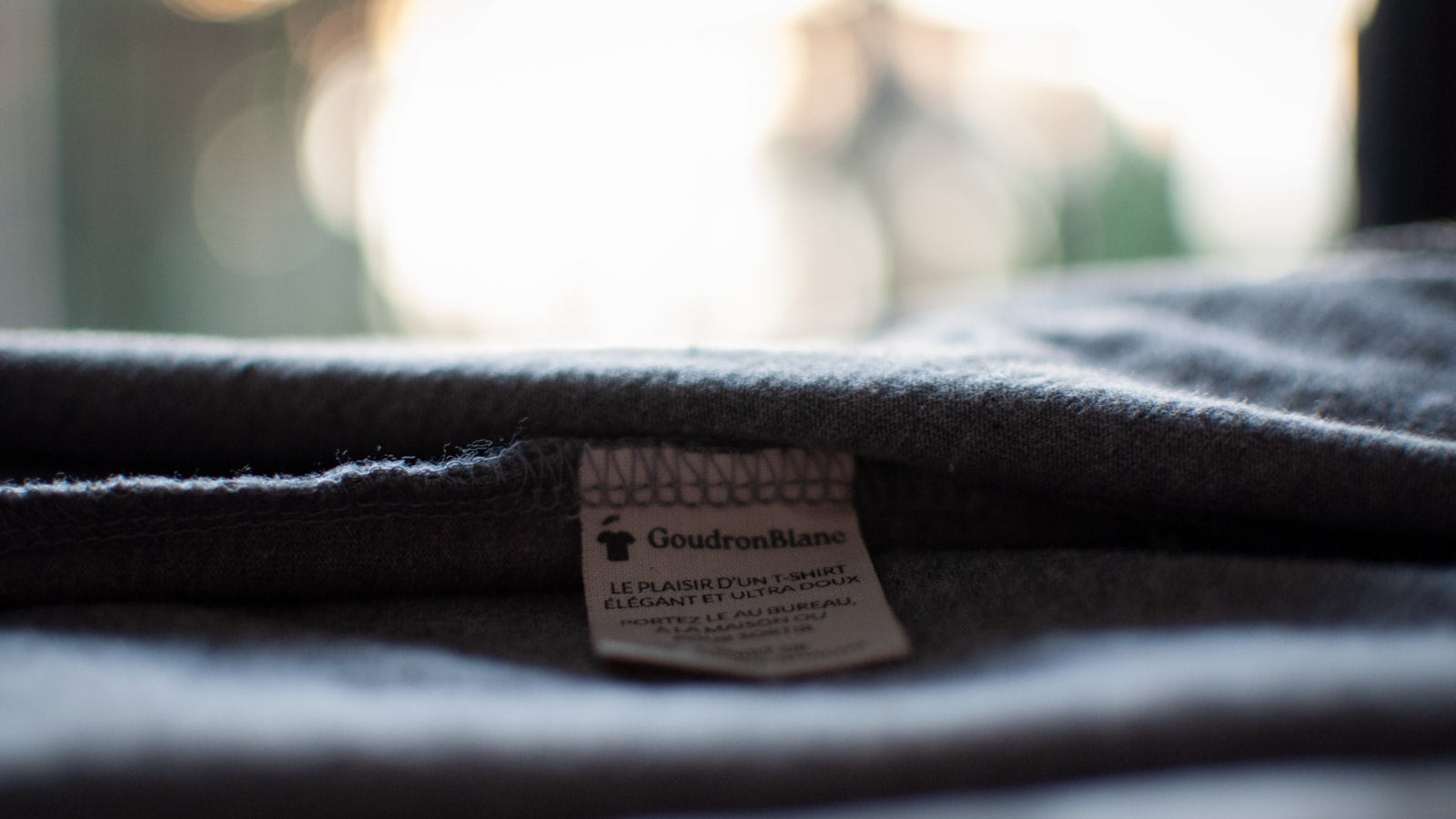 Clothing label close-up — how to spot fake streetwear before it spots you